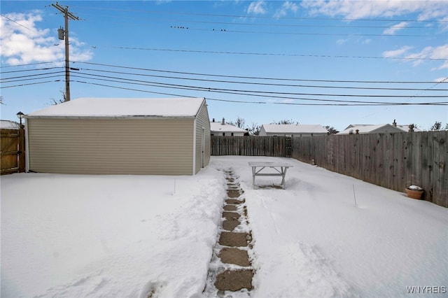 view of yard layered in snow