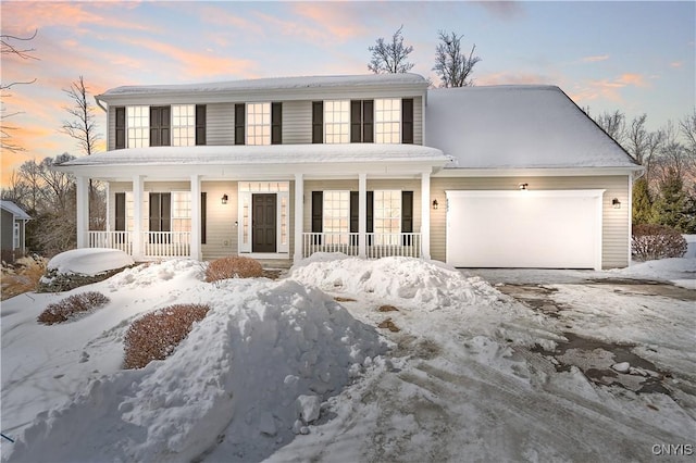 view of front of home with a porch and a garage