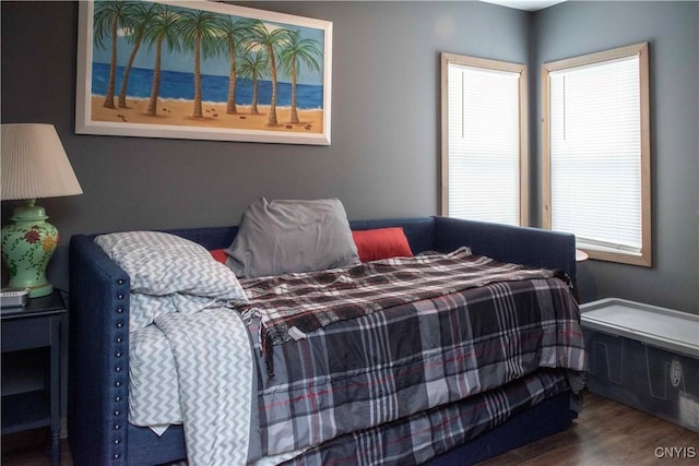 bedroom with wood-type flooring