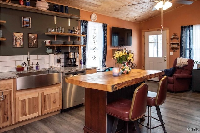 kitchen with butcher block counters, wooden ceiling, dark hardwood / wood-style flooring, vaulted ceiling, and stainless steel dishwasher