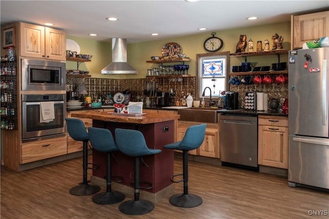 kitchen featuring ventilation hood, appliances with stainless steel finishes, dark hardwood / wood-style floors, and light brown cabinetry