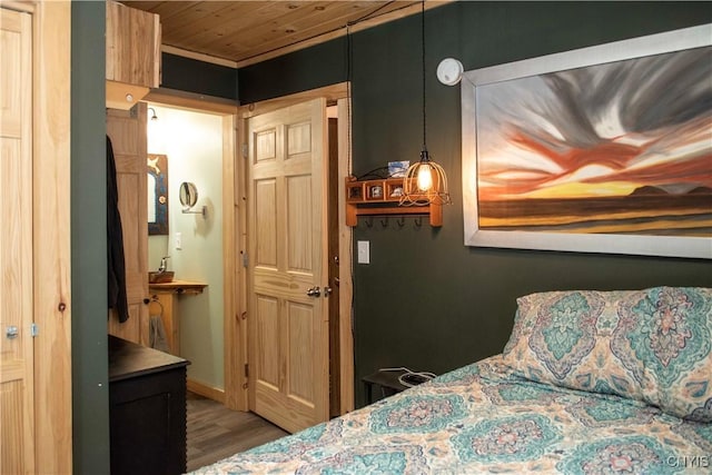 bedroom featuring wood ceiling and dark hardwood / wood-style flooring