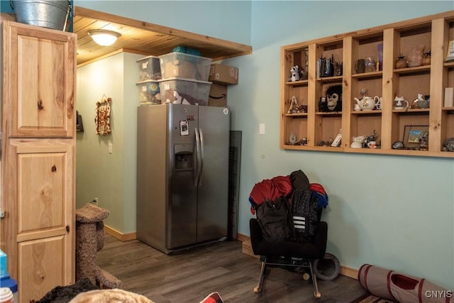 kitchen featuring dark hardwood / wood-style floors, wood ceiling, and stainless steel fridge with ice dispenser