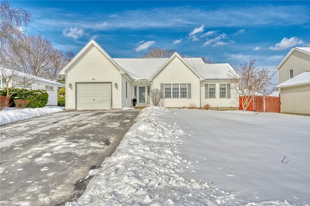 ranch-style house featuring a garage