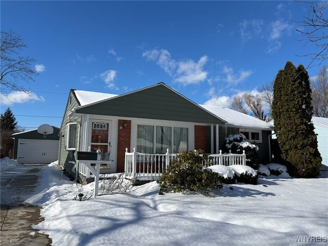 view of front of house featuring a garage and an outdoor structure