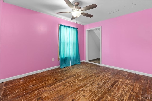 spare room with hardwood / wood-style floors and ceiling fan