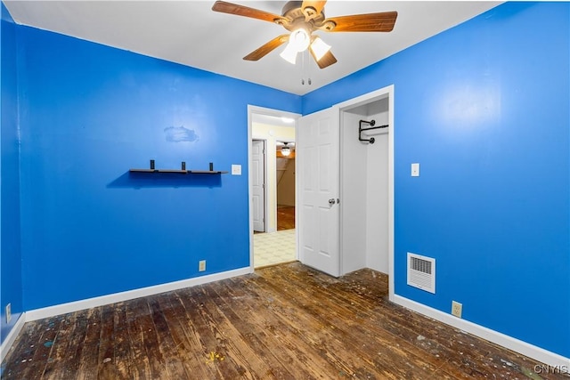 unfurnished room with hardwood / wood-style flooring and ceiling fan