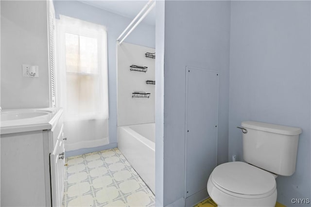 full bathroom featuring vanity,  shower combination, and toilet