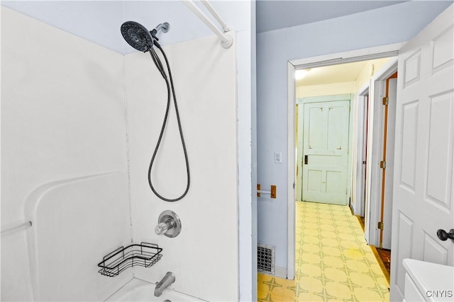 bathroom featuring washtub / shower combination