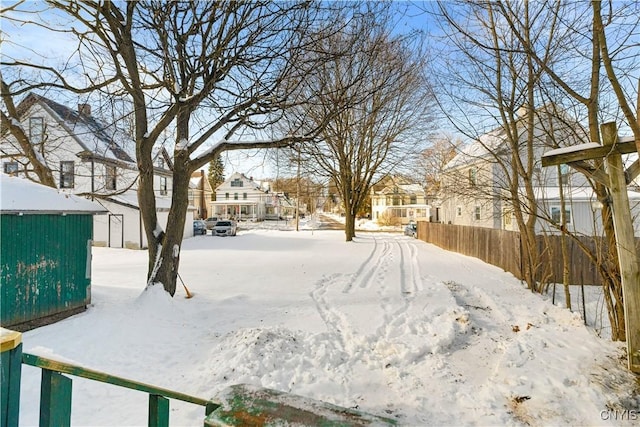 view of yard layered in snow