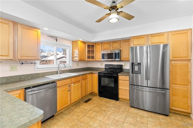 kitchen featuring ceiling fan, appliances with stainless steel finishes, and sink