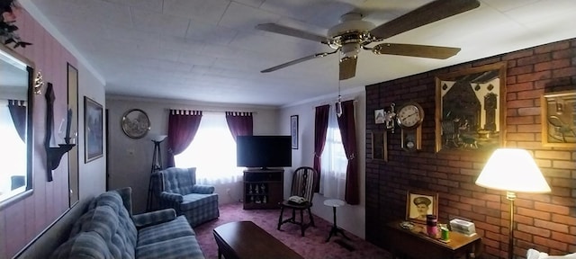 living room with crown molding and brick wall