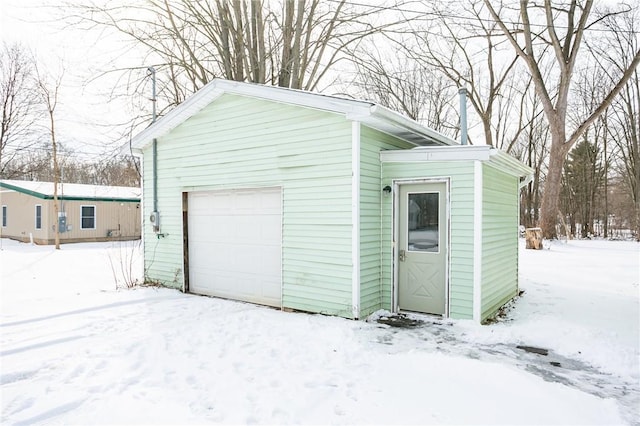 view of snow covered garage