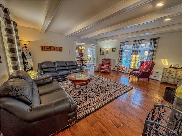 living room with hardwood / wood-style floors, beam ceiling, a baseboard radiator, and a chandelier