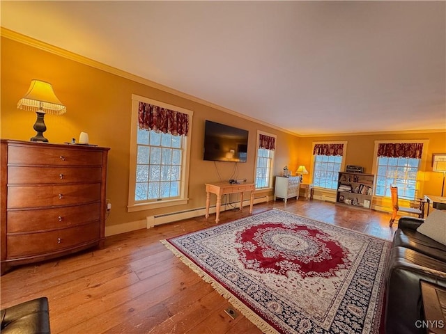 living room with a baseboard radiator, a healthy amount of sunlight, crown molding, and light hardwood / wood-style flooring