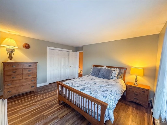 bedroom featuring a closet and dark hardwood / wood-style floors