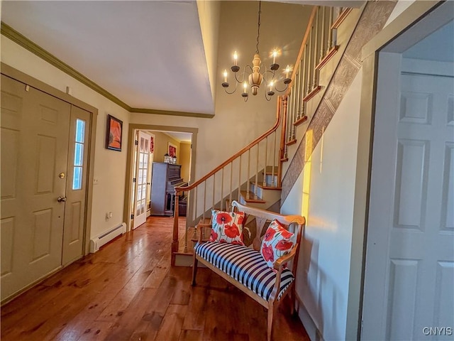 foyer featuring crown molding, a baseboard radiator, an inviting chandelier, and hardwood / wood-style floors