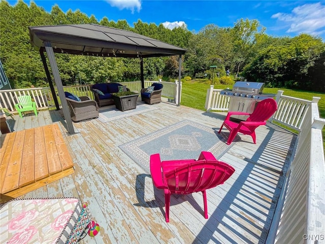 deck featuring a gazebo, area for grilling, and an outdoor living space