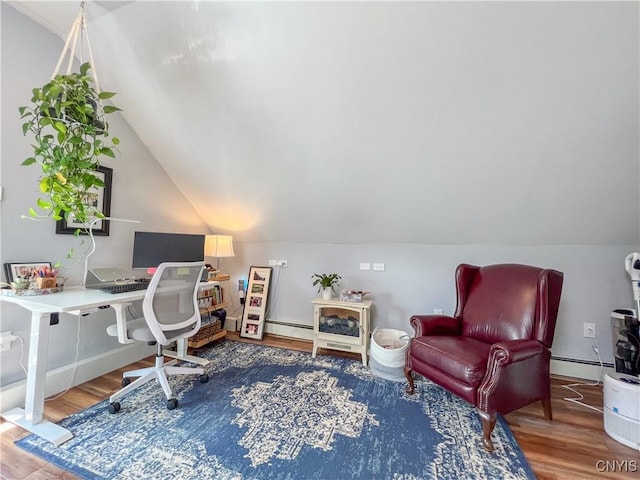 office with lofted ceiling, a baseboard heating unit, and hardwood / wood-style floors