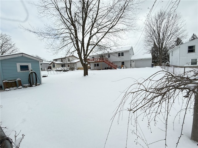 view of yard layered in snow