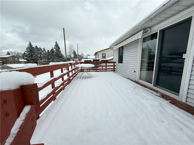 view of snow covered deck