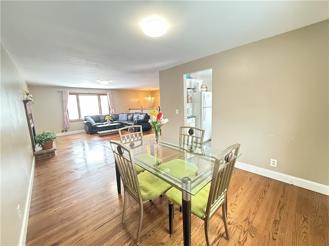 dining room with light wood-type flooring