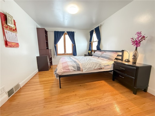 bedroom with light wood-type flooring