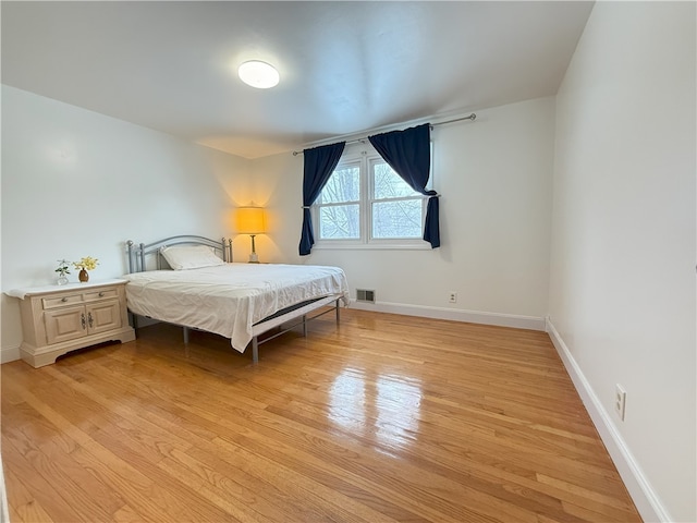 bedroom featuring light hardwood / wood-style floors