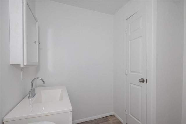 bathroom featuring vanity and hardwood / wood-style floors