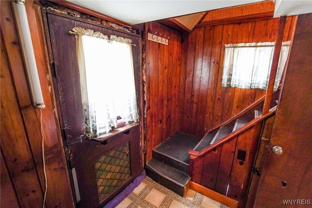 stairway with wood walls