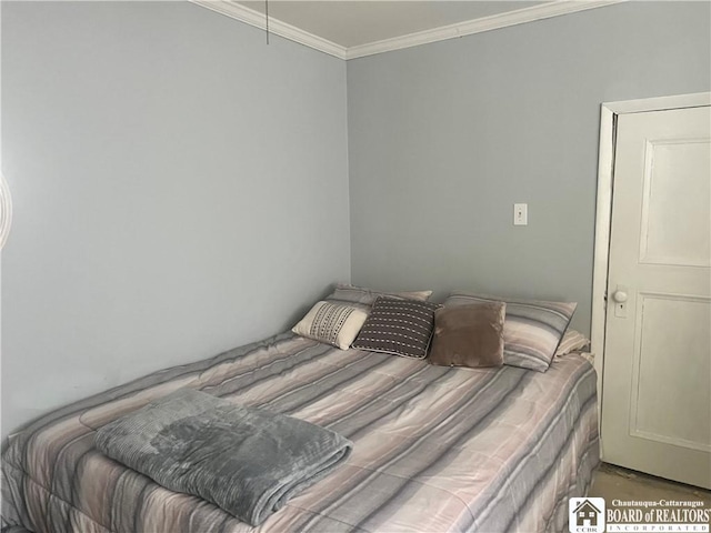 bedroom featuring crown molding