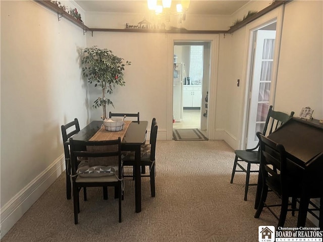 view of carpeted dining area