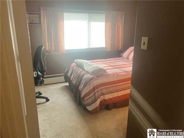 bedroom featuring a baseboard radiator and carpet floors