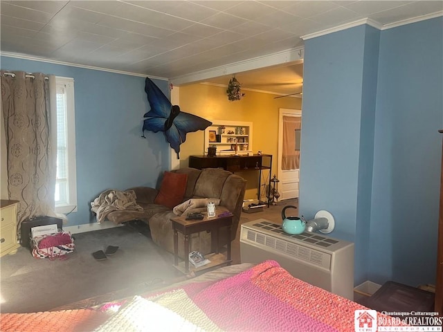 carpeted bedroom featuring crown molding