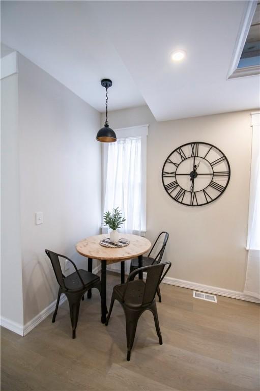 dining area featuring wood-type flooring