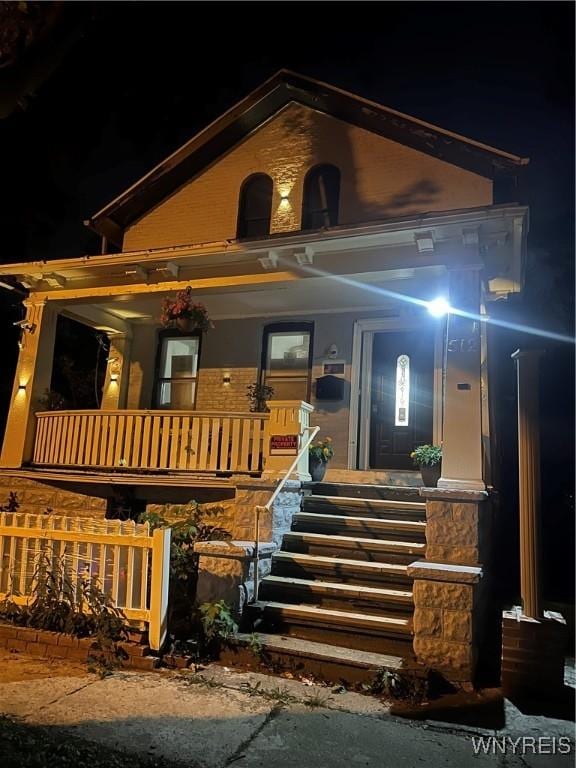 view of front of property featuring covered porch