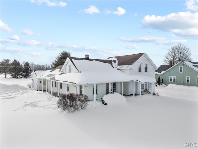 view of snow covered house