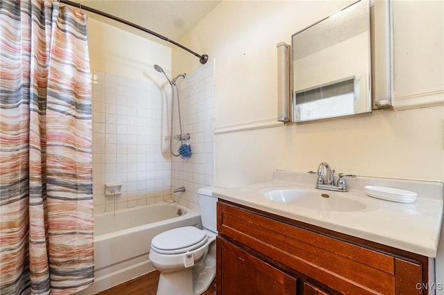 full bathroom with shower / tub combo with curtain, vanity, hardwood / wood-style flooring, and toilet