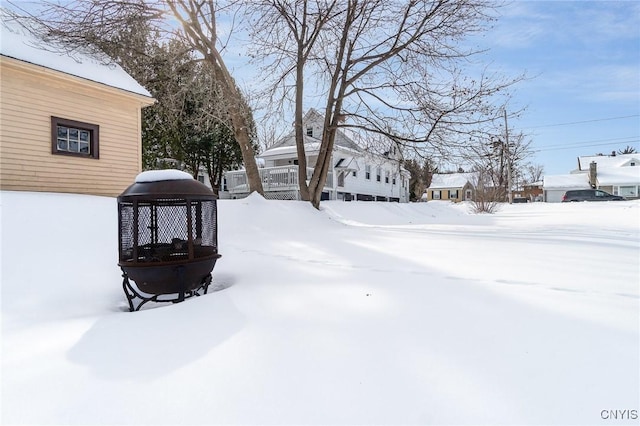 view of yard layered in snow