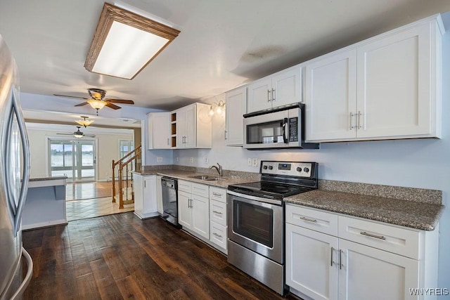 2202 River Rd, Wheatfield, NY 14304 - kitchen featuring appliances with stainless steel finishes, a sink, a ceiling fan, dark wood finished floors, and white cabinets
