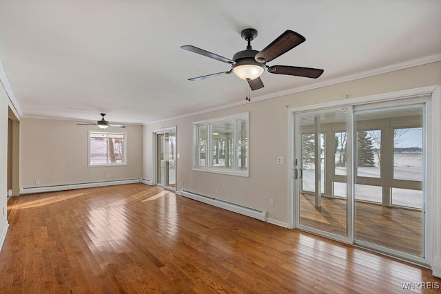 2202 River Rd, Wheatfield, NY 14304 - unfurnished living room with a baseboard heating unit, crown molding, a ceiling fan, a baseboard radiator, and wood finished floors