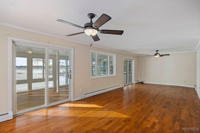 2202 River Rd, Wheatfield, NY 14304 - empty room featuring a baseboard heating unit, ornamental molding, ceiling fan, and wood finished floors