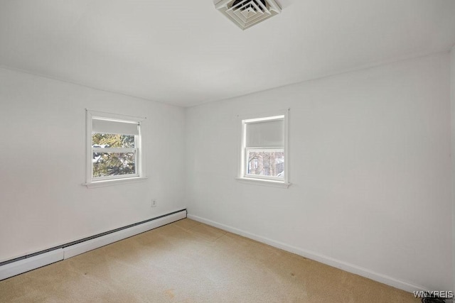 2202 River Rd, Wheatfield, NY 14304 - empty room with a baseboard radiator, light carpet, and baseboards