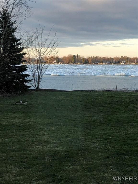 2202 River Rd, Wheatfield, NY 14304 - yard at dusk featuring a water view and a yard