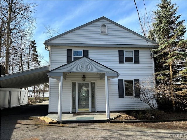 2202 River Rd, Wheatfield, NY 14304 - view of front of house with asphalt driveway and a carport