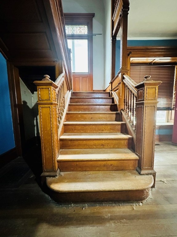 stairs with hardwood / wood-style floors