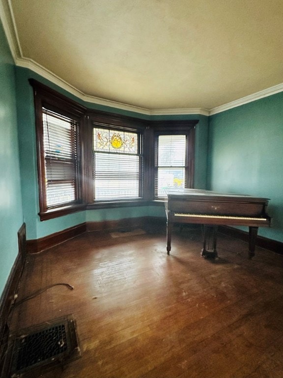 misc room featuring crown molding and hardwood / wood-style flooring