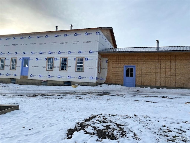 view of snow covered house