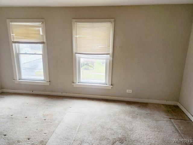 17 Beattie Ave, Lockport-City, NY 14094 - carpeted empty room with baseboards
