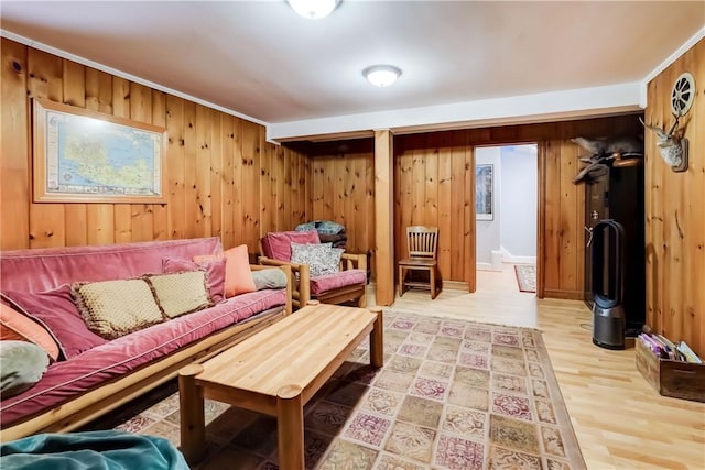 sitting room featuring hardwood / wood-style floors and wood walls